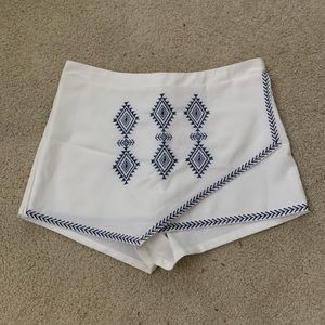 White skirt with blue embroidery
